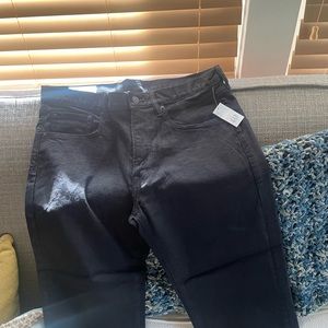 Brand new, tags still on black boot cut jeans for men.